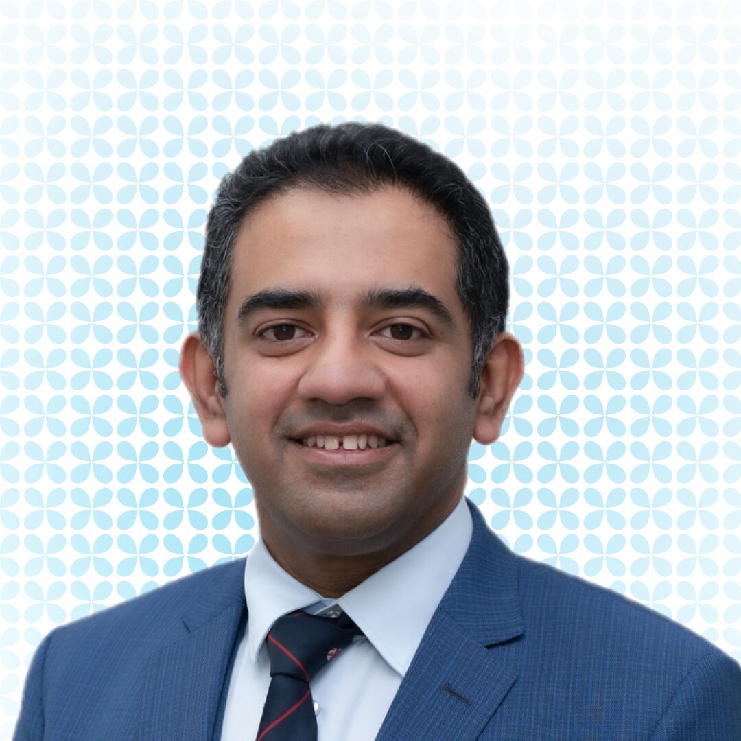 Portrait of dr. Irfan in a light blue suit