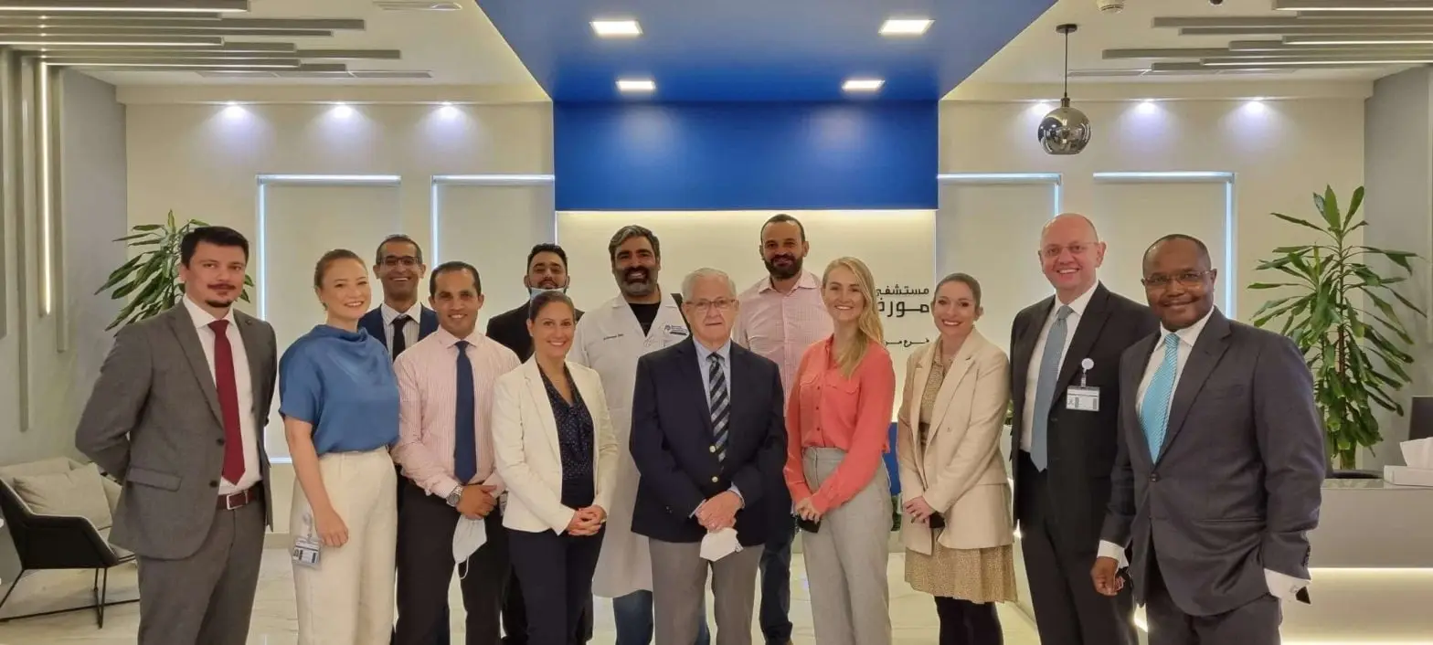 Group photo of Moorfields Eye Hospital team celebrating JCI accreditation.