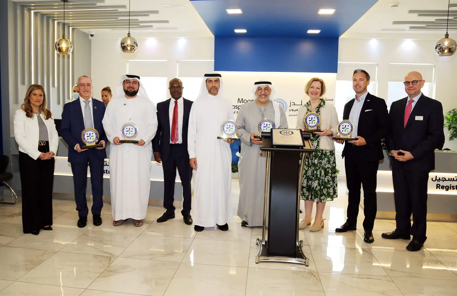 Group image of leadership teams from Dubai Health, Dubai Health Authority, Moorfields Dubai and Moorfields London for the celebration of Moorfields Dubai as the first center of excellence in the region